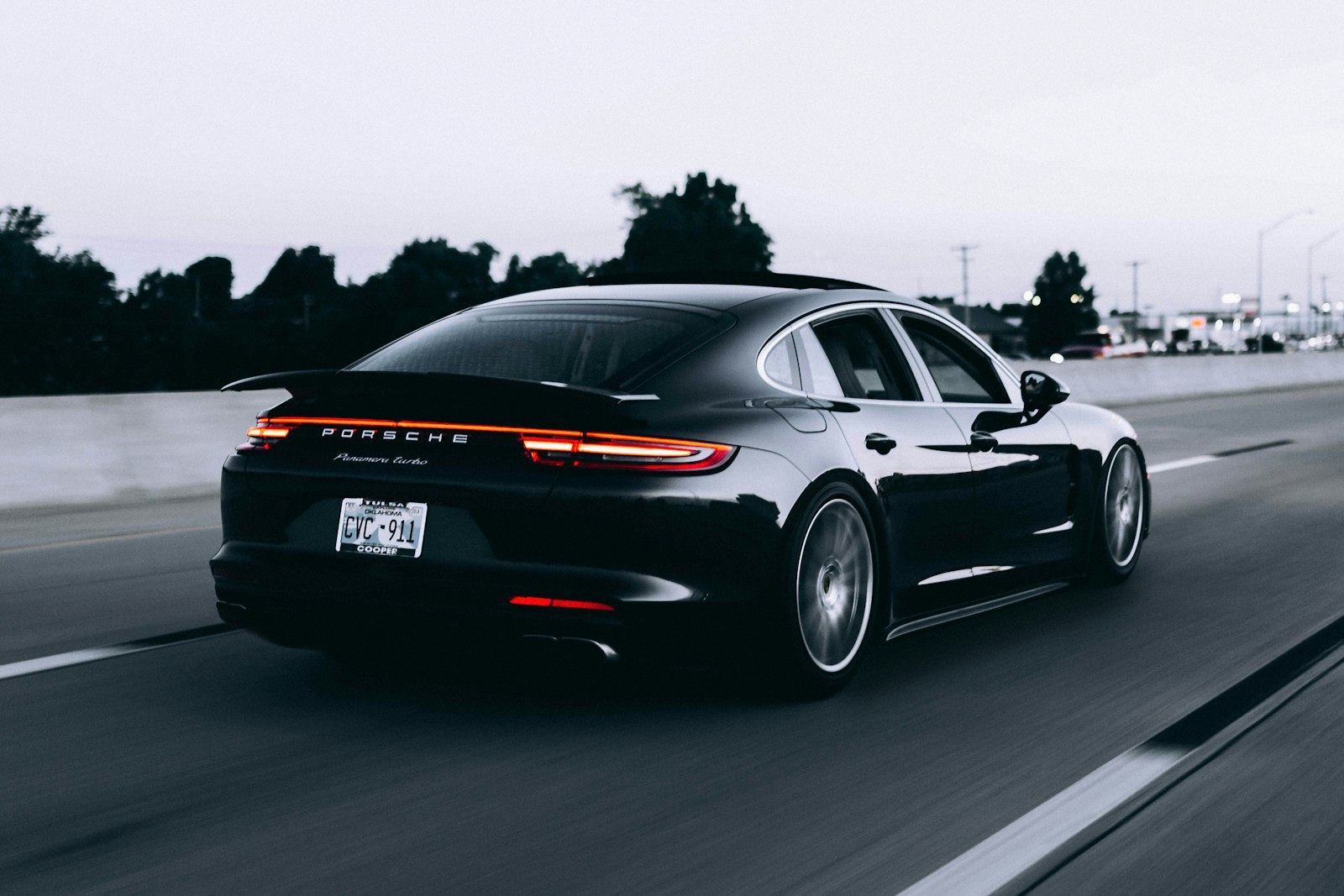 A sleek sedan on an open coastal highway